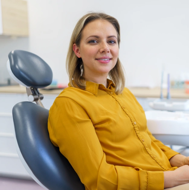 Patient seated in a dental chair for periodontal disease treatment
