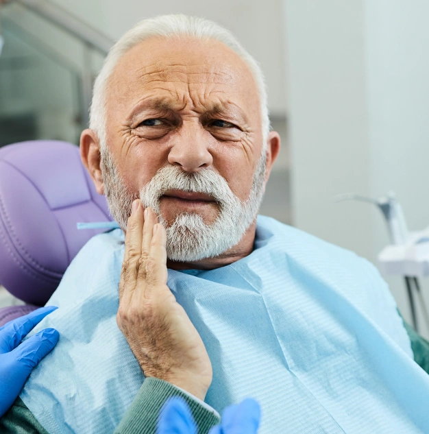 Patient with tooth pain before tooth extraction treatment