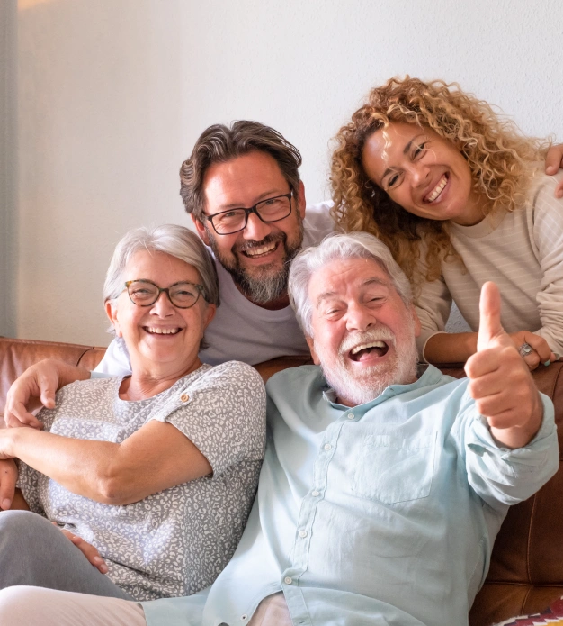 Three generations of a family smiling together and embracing